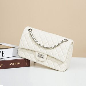 Quilted Lambskin Leather Classic Flap Bag Offwhite Silver sloping on a book